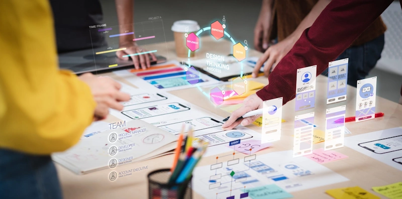 A digital marketing company on a design project with holographic displays of a design