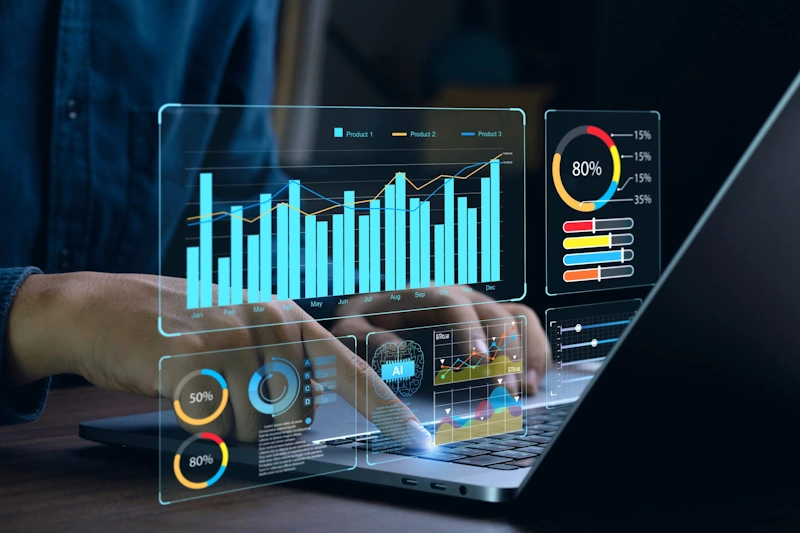 Person using a laptop showing s digital marketing company's charts and graph