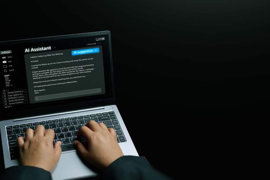 Hands typing on a laptop screen displaying an AI assistant interface generating an automated email follow-up response, exploring what is the best ai tool for email copywriting.